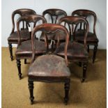 A set of six Victorian mahogany spoon back dining chairs