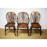 Three 19th Century ash and elm wheel back Windsor chairs