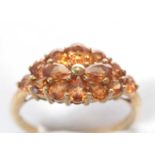 A Spessartite garnet cluster ring.