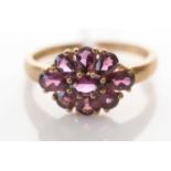 A Rhodolite garnet cluster ring.