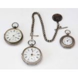 Three silver-cased open-faced pocket watches.