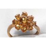 A citrine cluster ring.