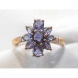 An Iolite cluster ring.