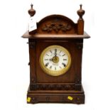 A late 19th Century oak cased mantel clock