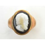 A carved stone cameo ring