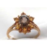 A smokey quartz and citrine cluster ring.