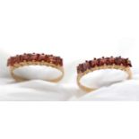 Two garnet rings.