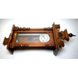 An early 20th Century Viennese style walnut wall clock