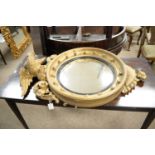 A 20th Century reproduction convex wall mirror; together with another