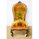 A Victorian rosewood nursing chair.