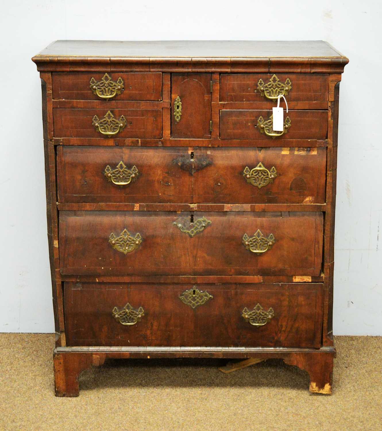 An 18th Century walnut veneered chest of drawers