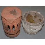 A stoneware planter and a terracotta jardiniere stand.