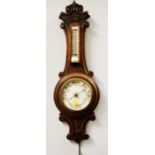 A Victorian oak cased aneroid barometer
