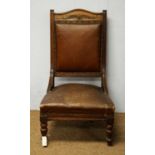 A late Victorian beech easy armchair