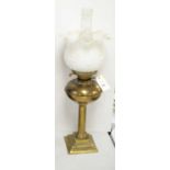 A brass corinthian column oil lamp,