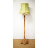 An early 20th Century oak standard lamp.