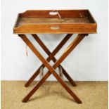 An early 20th Century mahogany butlers' tray on stand
