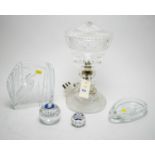 A selection of glass ware including a Swedish glass paperweight and a table lamp.