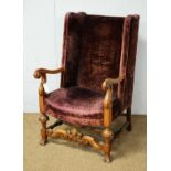 Early 20th C walnut wing back armchair.