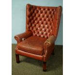 20th C leather upholstered wing-back armchair.
