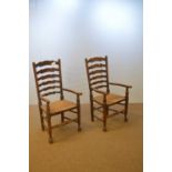 Pair of early 20th C elm ladder back chairs.