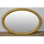 Early 20th C gold painted oval wall mirror.