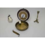 A set of scales, candlestick and a jar