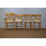 Set of four 20th C beech kitchen chairs (one carver).