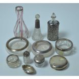 A selection of silver and white metal mounted hobnail and other cut glass jars.