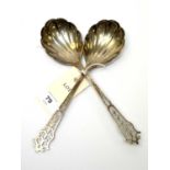 A pair of Edwardian silver serving spoons.