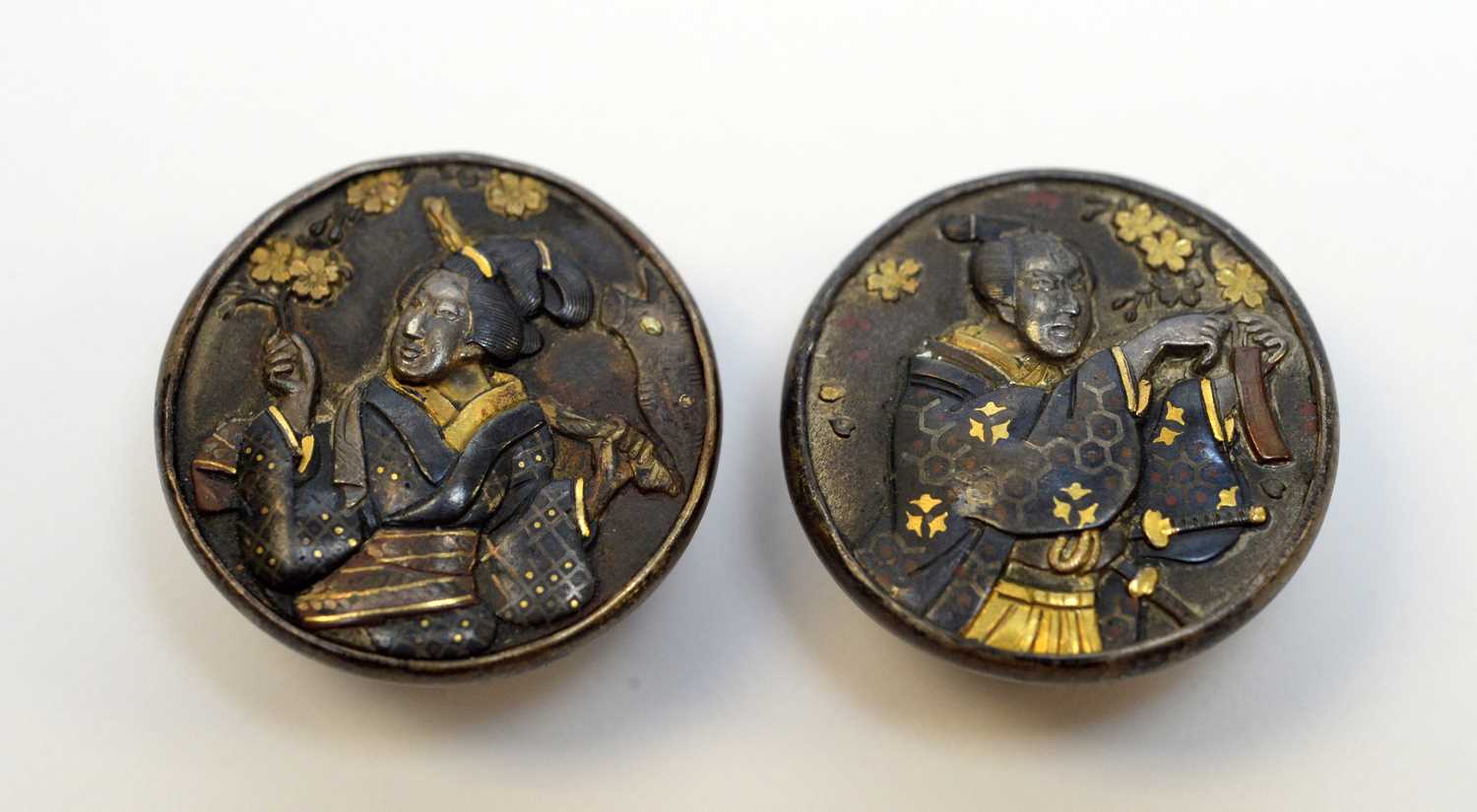 Two Meiji Japanese shakudo and shibuichi shirt studs.