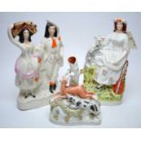 Two Staffordshire figure groups and a Staffordshire figural vase