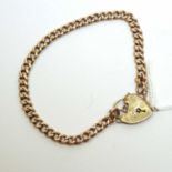A 9ct gold curb-link charm bracelet with heart-shaped padlock clasp.