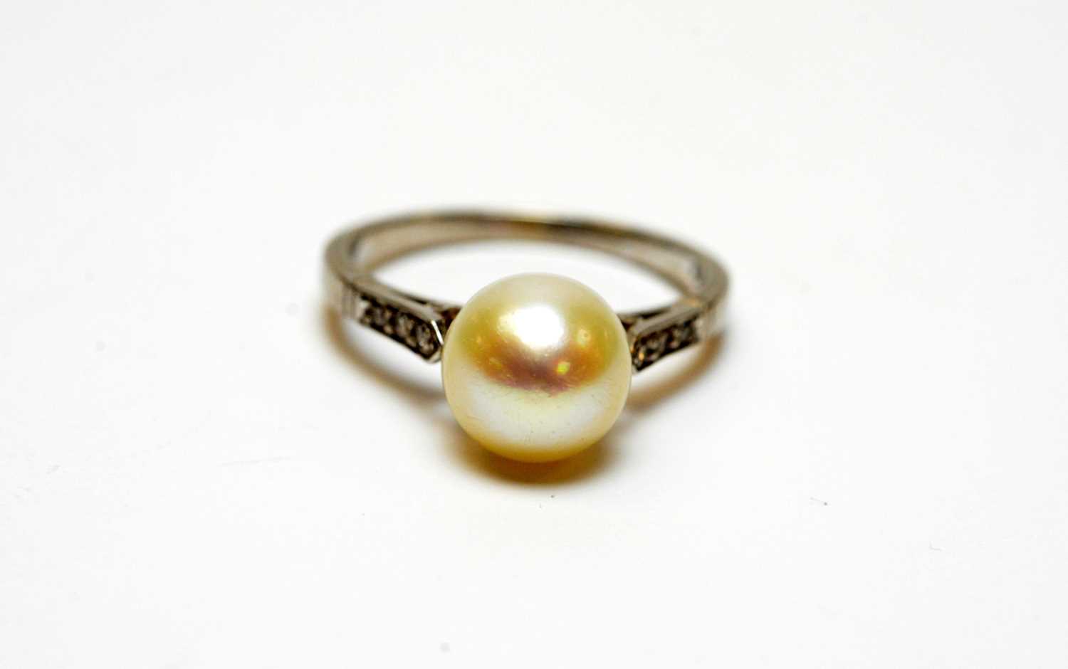 A high-carat white metal, diamond, and pearl solitaire cocktail ring. - Image 2 of 6