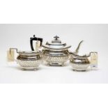 An Edwardian three-piece silver tea service.