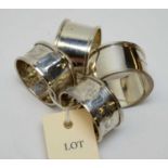 Two pairs of silver napkin rings.