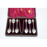 A cased set of six Edwardian silver teaspoons and sugar tongs.