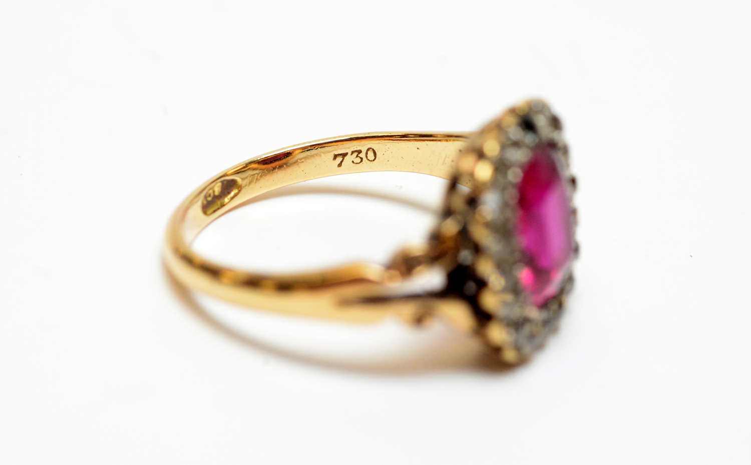 A yellow metal, diamond, and synthetic ruby ring. - Image 3 of 4