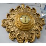 A French Art Deco gilt sunburst wall clock