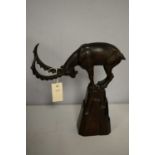 Carved wood sculpture of an ibex