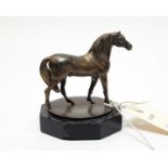 An electroplate statuette of a standing horse.
