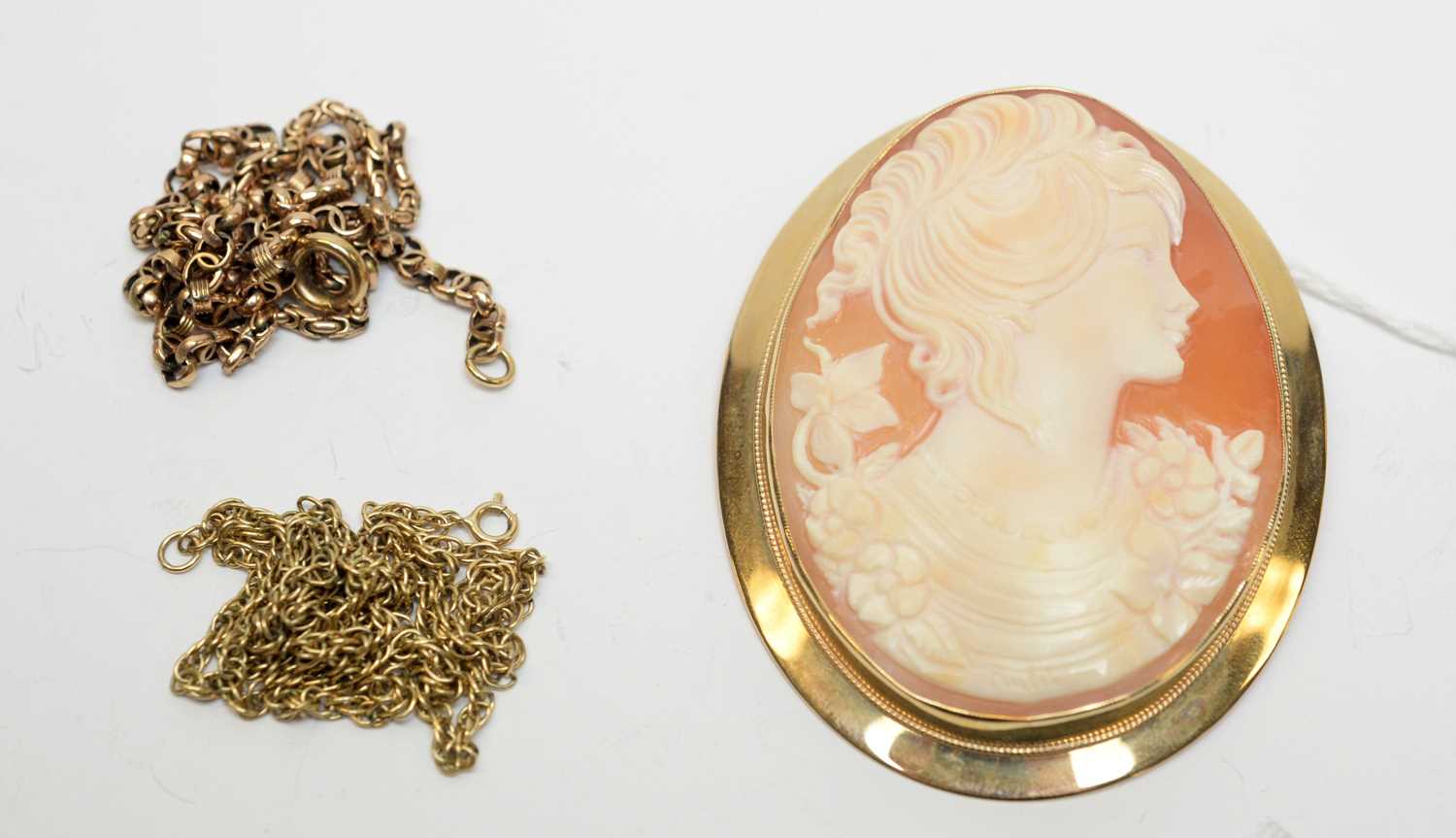 A 9ct gold cameo pendant brooch and chains.