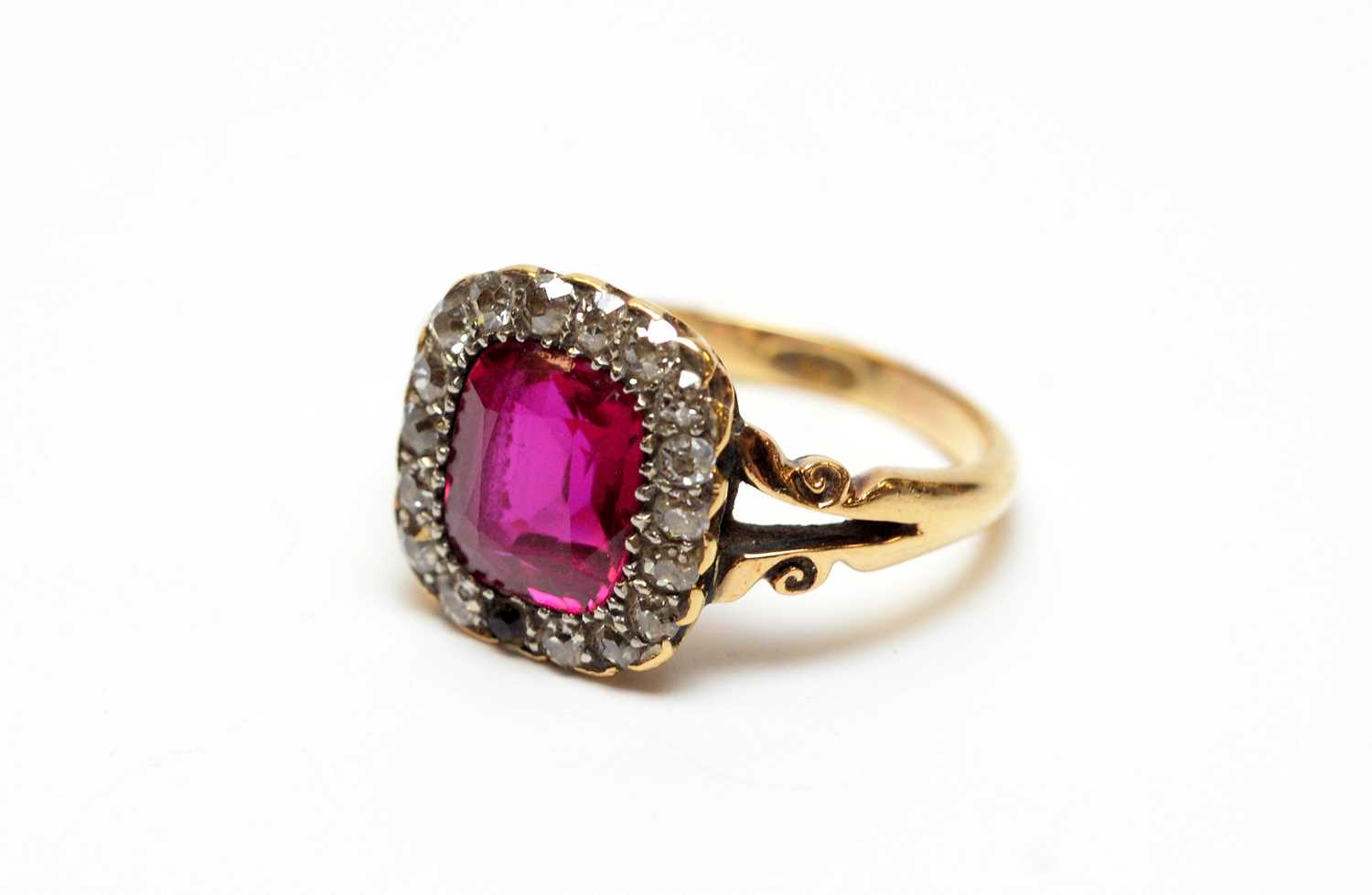 A yellow metal, diamond, and synthetic ruby ring. - Image 2 of 4