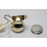 A Victorian silver jug, and a silver pill box.