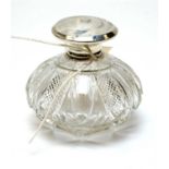 A George V silver mounted cut glass perfume bottle.