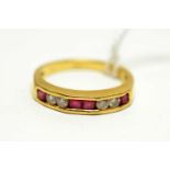 A contemporary 18ct gold, ruby, and diamond ring.