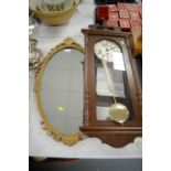 A German wall clock and a wall mirror