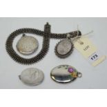 Antique white metal lockets.