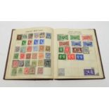 A stamp album including a Penny Black