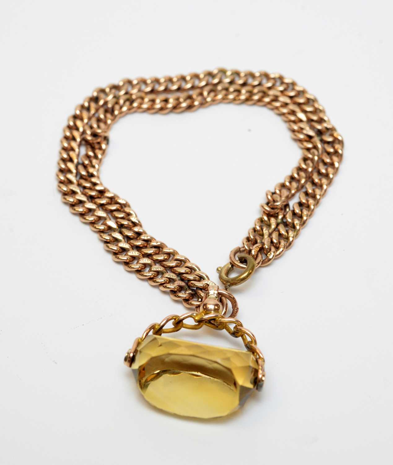 An antique 9ct gold watch chain bracelet with citrine fob seal charm.